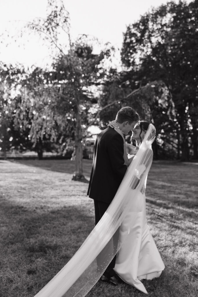 Black-and-white documentary wedding photography capturing the bride and groom at a Connecticut summer wedding.