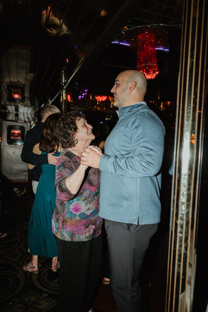 Family dancing at a dinner cruise wedding rehearsal. 