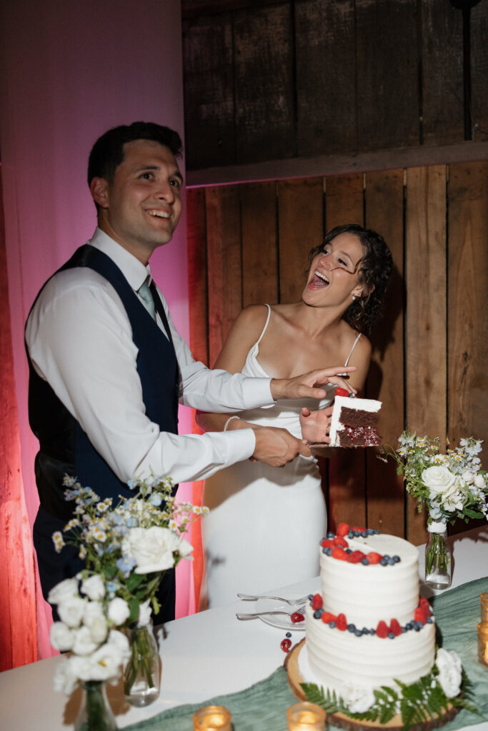 direct flash photo of couple cutting their wedding cake 